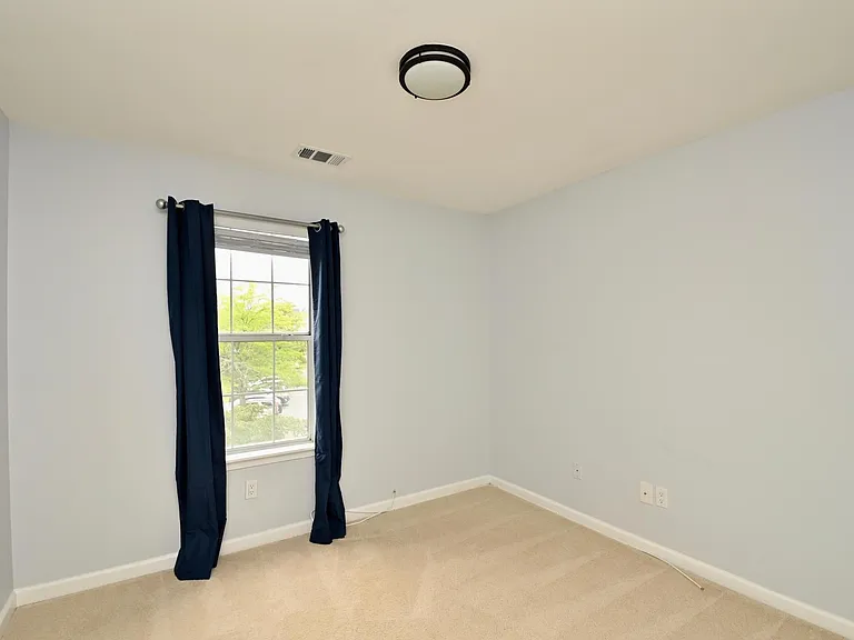 Second bedroom - good for an office or extra storage area.