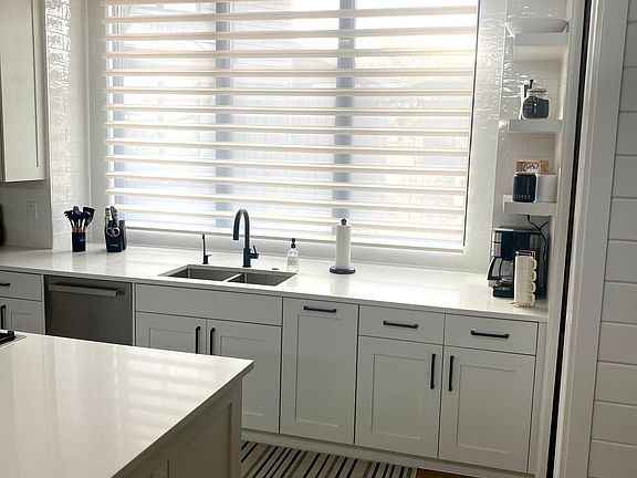Kitchen with automatic custom blinds