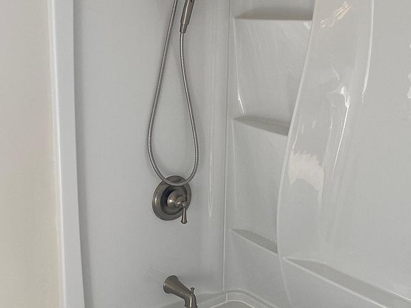 New tub surround with luxury shower head and hand held sprayer