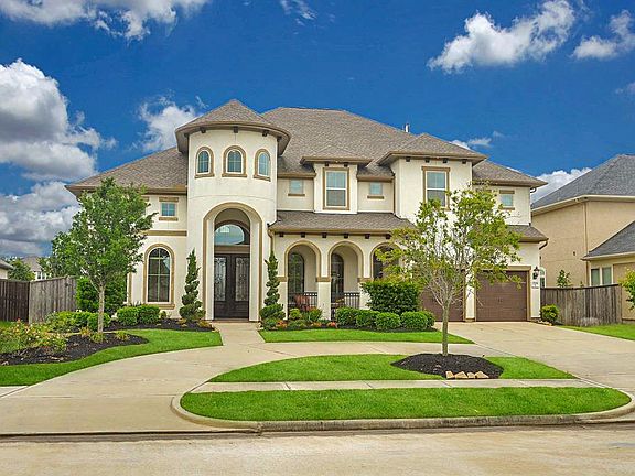 Stunning stucco & brick exterior with a 3 Car tandem garage, circle driveway and covered front porch. Upgraded lighting added to the overhangs.