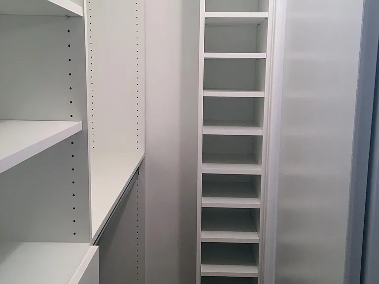 Primary bedroom walk-in closet