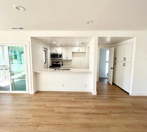 fully remodeled kitchen with easy access to serene patio area