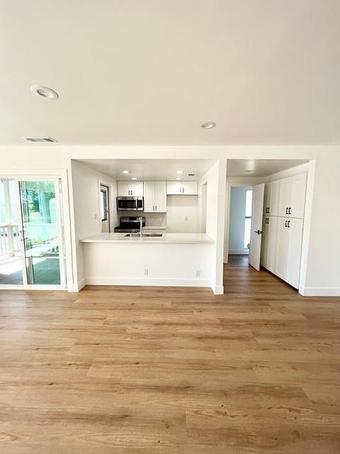 fully remodeled kitchen with easy access to serene patio area