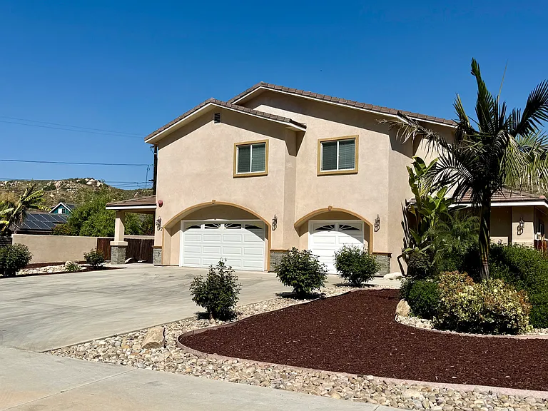 Front yard of home, 3-car garage