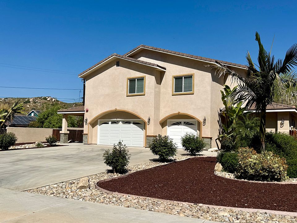 Front yard of home, 3-car garage