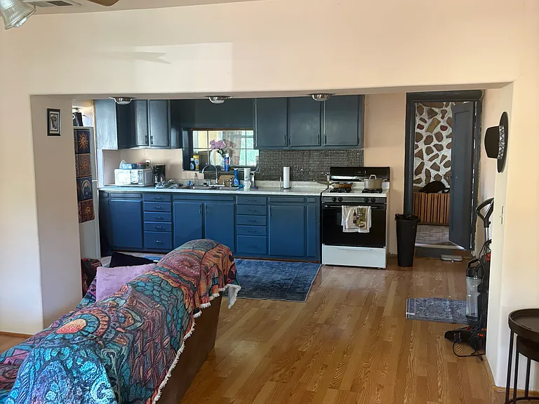 Entrance into living room and kitchen area / recessed lighting in living room