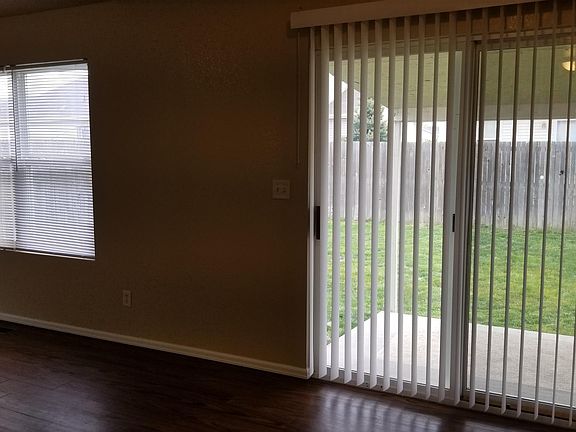 Door to covered patio off kitchen.
