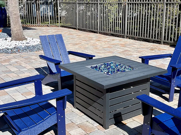 Unwind and soak up warmth by the poolside firepit, creating cozy moments and enhancing the overall poolside experience.