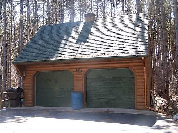 4 stall garage with unfinished rec room above.
