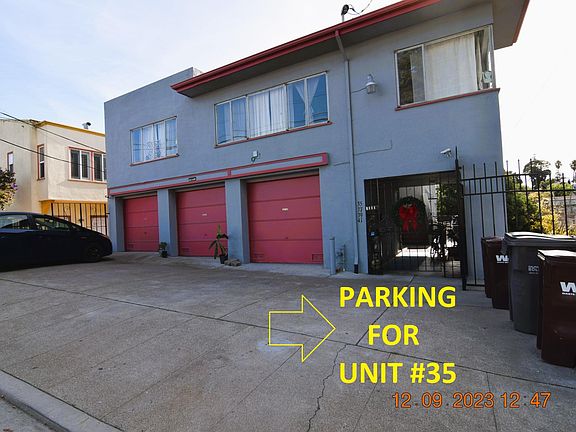 The assigned parking space is in front of the main gate and next to the trash cans