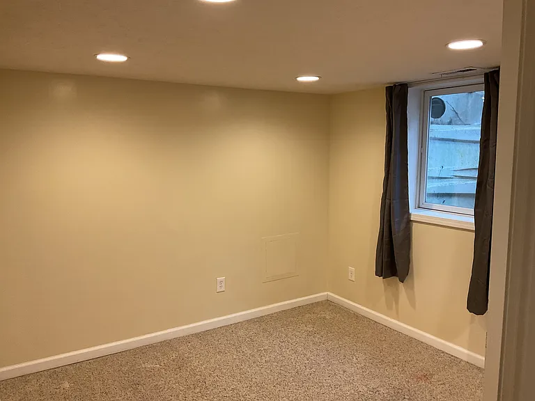 1st of 2 Bedroom on Lower Level with Carpet, full size window and blackout curtains.