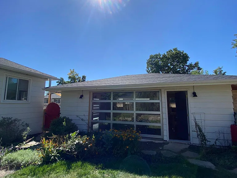 View of backyard and north side of garage/office