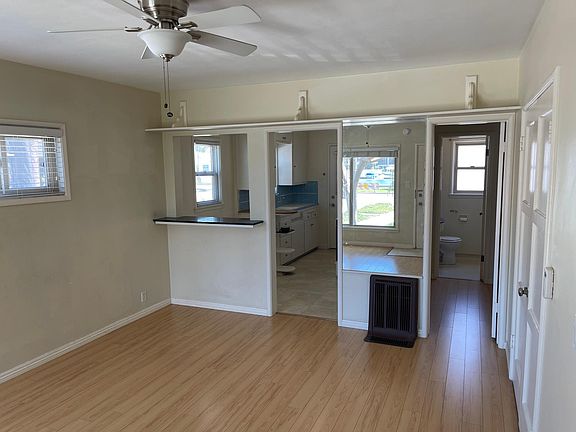 Living room looking at kitchen and bath