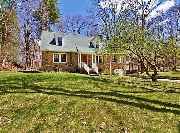 Plenty of room for children and dogs to roam and play on this gorgeous, shy 3/4 acre property