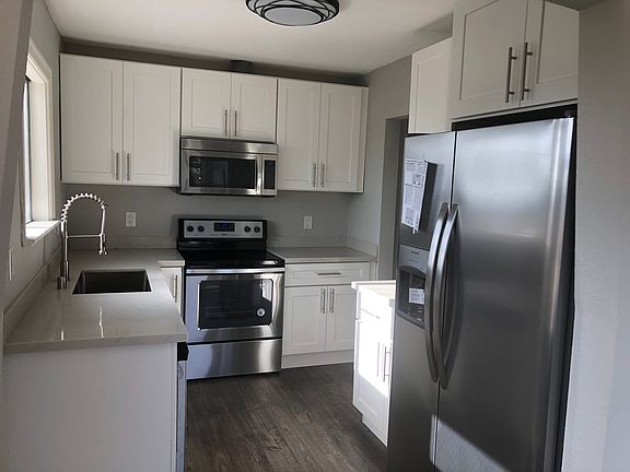 Updated Kitchen with quartz countertops and stainless steel appliances.