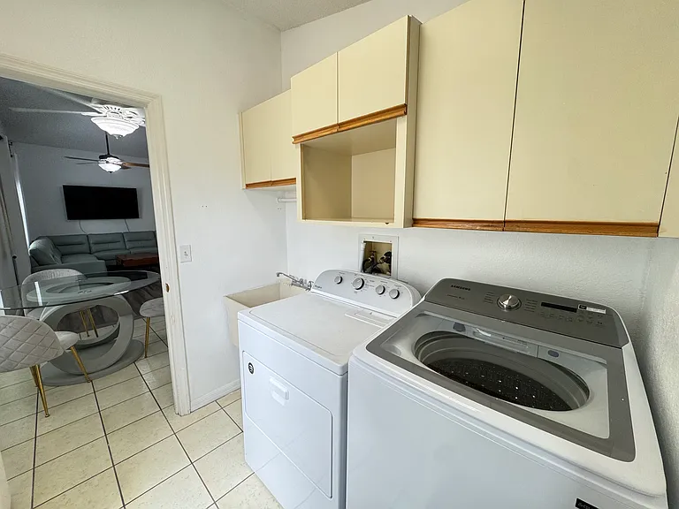 Laundry room with washer & dryer and plenty of cabinet space