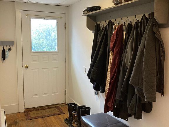 Entrance/mudroom with custom shelving