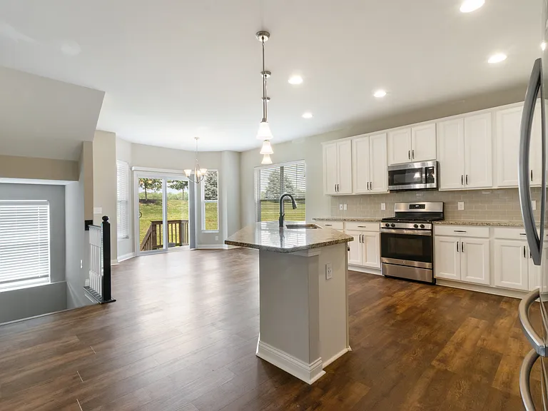 Kitchen and stairs to basement. Basement is unfinished