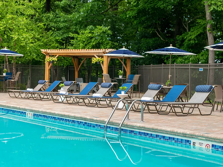 Step into our poolside paradise, where sun loungers, shaded tables, and a welcoming firepit create the ultimate gathering spot for friends and family.