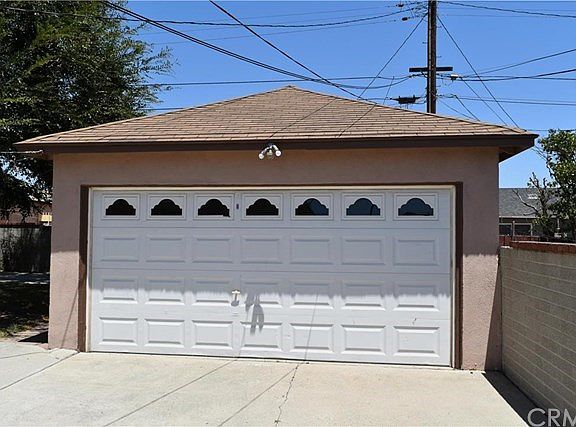 Detached, 2-car garage with roll up garage door.