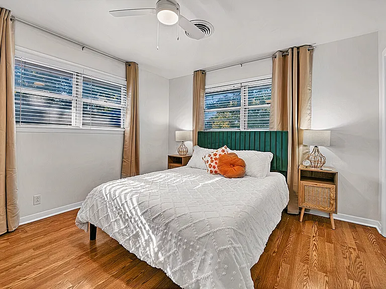 Comfortable secondary bedroom with queen bed and coded door lock for security.