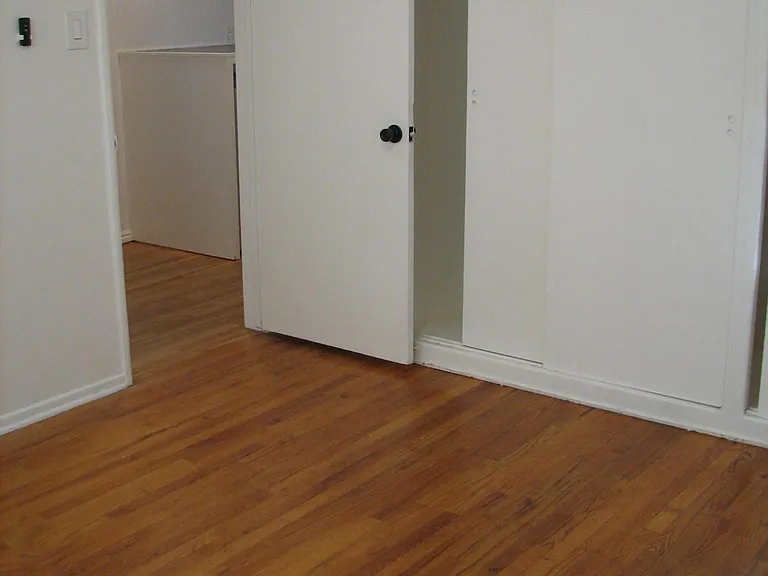 2nd bedroom( showing the large closet space) Carpet has been installed in the bedroom for comfort and soundproofing