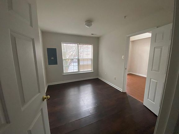 This is the spacious office or can be used as another room that hinges right off the foyer.