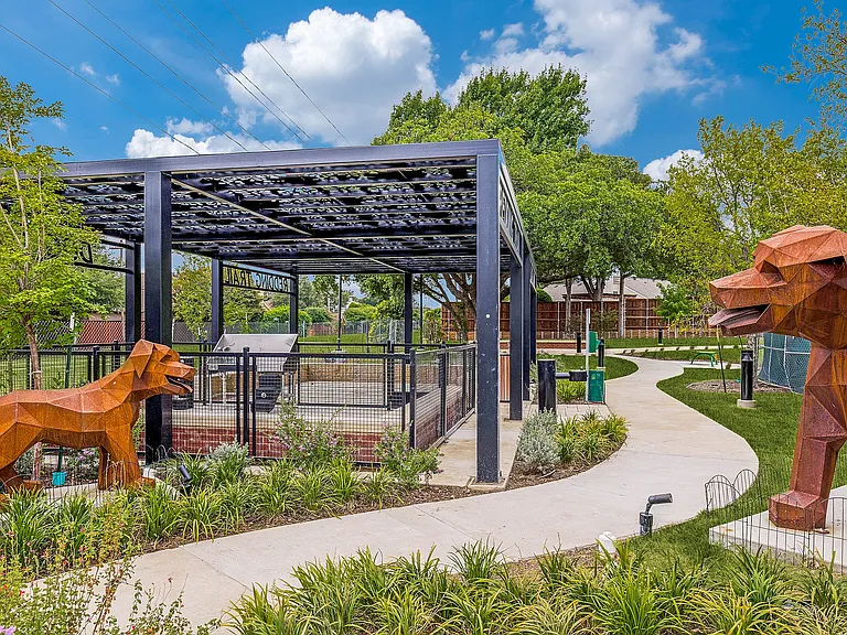 Landscaped dog park with covered pavilion,
