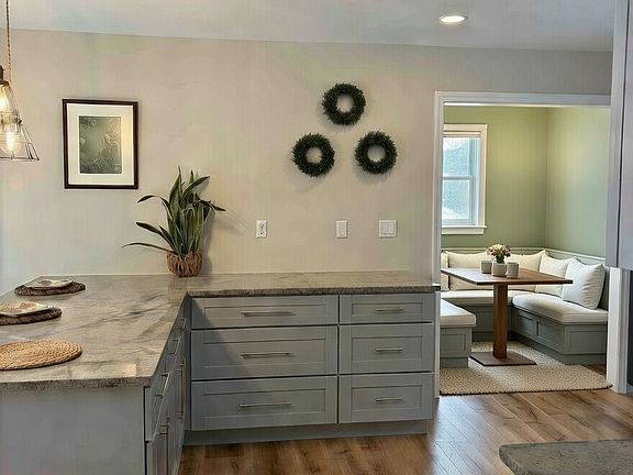 Kitchen with breakfast nook leading to deck. Furniture not included