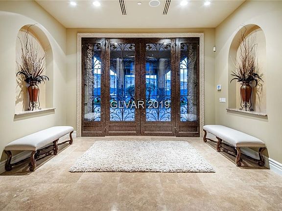 Foyer with custom rod iron double door entrance