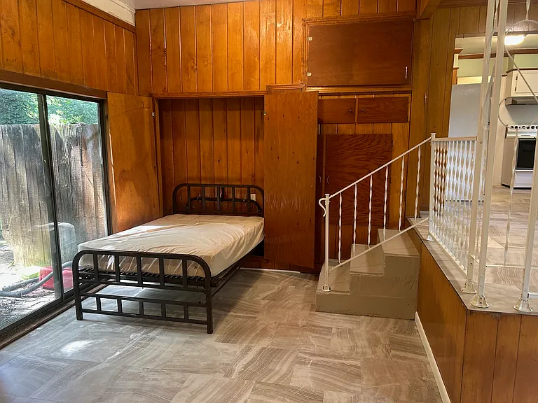 murphy bed folded down. There is also an ironing board that folds out of the wall (hidden behind murphy bed door)