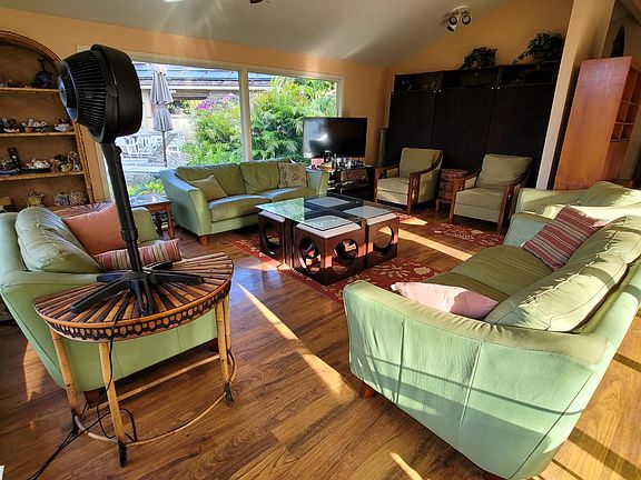 Another view of living room facing the pool and courtyard.