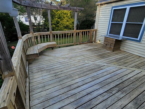 Spacious back deck with built-in bench and grilling table