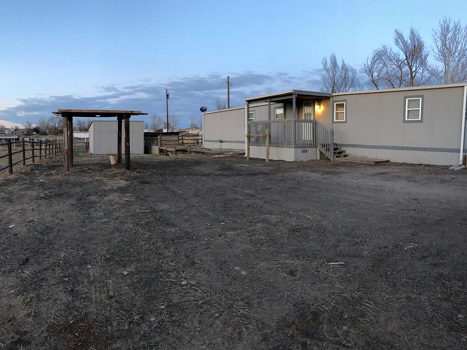 front view of the house and driveway. Storage shed in background is not part of the rent.