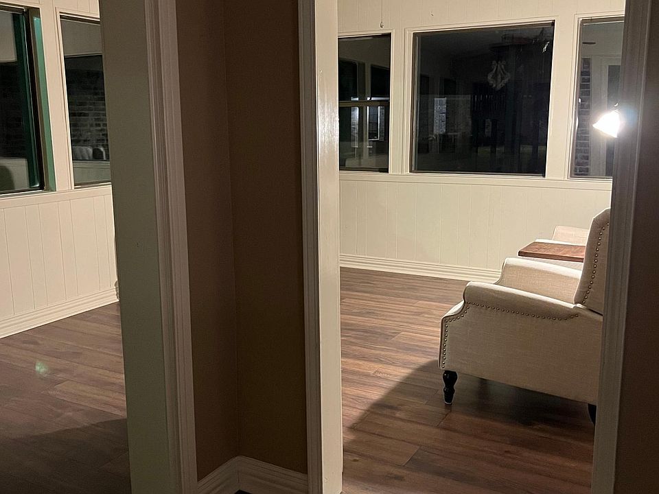 Open to kitchen and back door. Enclosed sun room. View is in next picture.