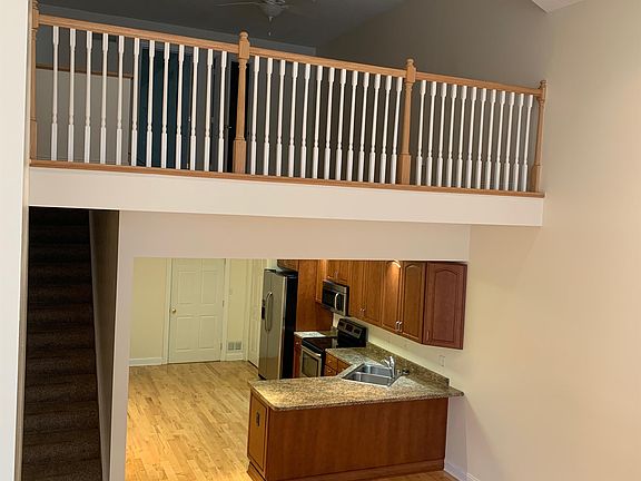 Kitchen with fridge, stove, and dishwasher.