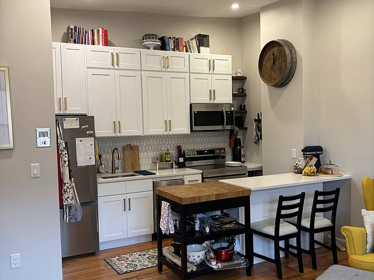 Kitchen with full size refrigerator, stove/oven, microwave, and dishwasher. All appliances are new in 2026.