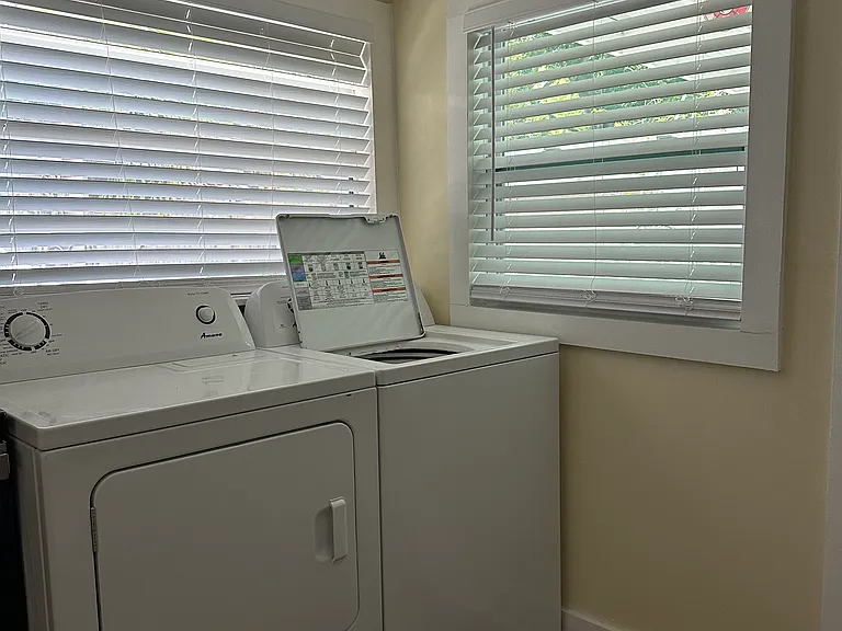 Indoor washer and drier adjacent to kitchen.