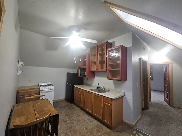 Kitchen includes gas stove and refrigerator