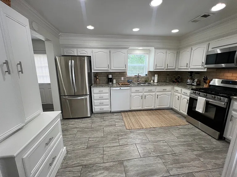 Open- floor kitchen with new appliances and storage galore!