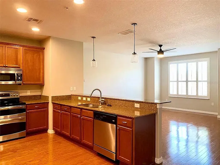 Kitchen Bar Island and Open Concept to Living Room w/ all high end finishes and LED Lighting