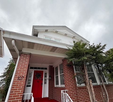Front exterior of house; brand new paint on porch & front door.