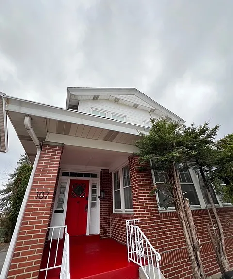 Front exterior of house; brand new paint on porch & front door.