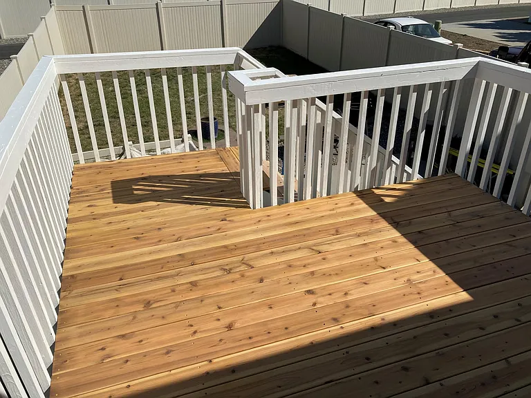 New in Sept '22 - Elevated private deck with access to fully-fenced backyard with lawn, patio and BBQ