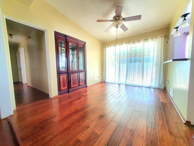 Spacious dining area with sliding glass door into the backyard. Includes built-in wooden display cabinet