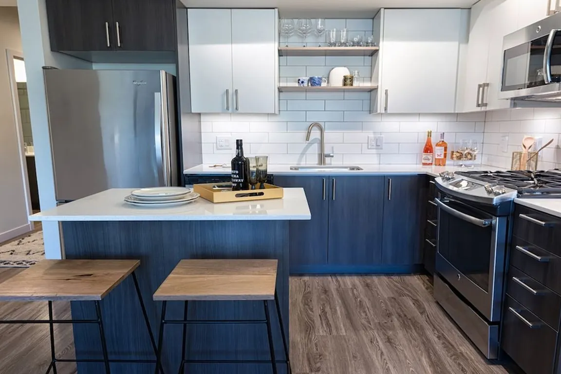Our kitchens feature high-end finishes including stainless steel appliances and quartz countertops