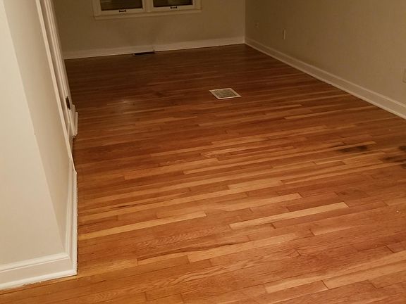 refinished hardwood floors in dormer room upstairs