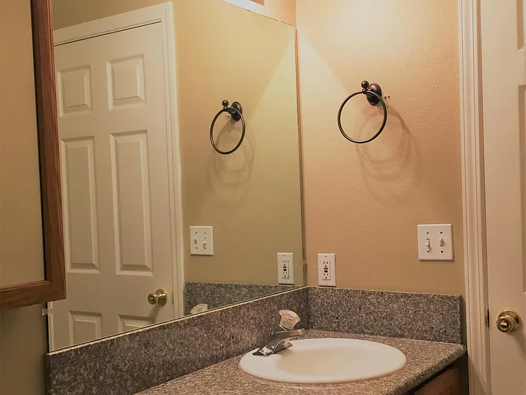 Full bath has granite countertops