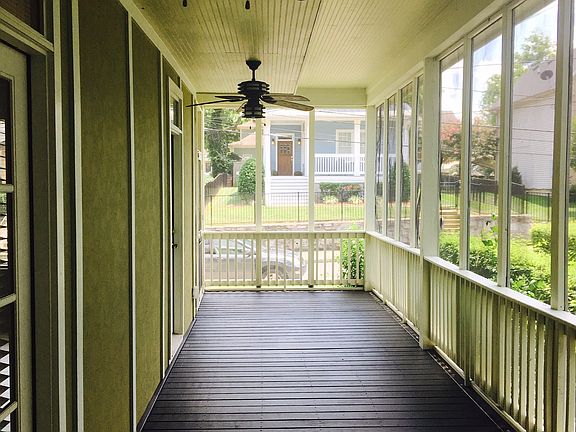 This home has a screened in wrap around porch...