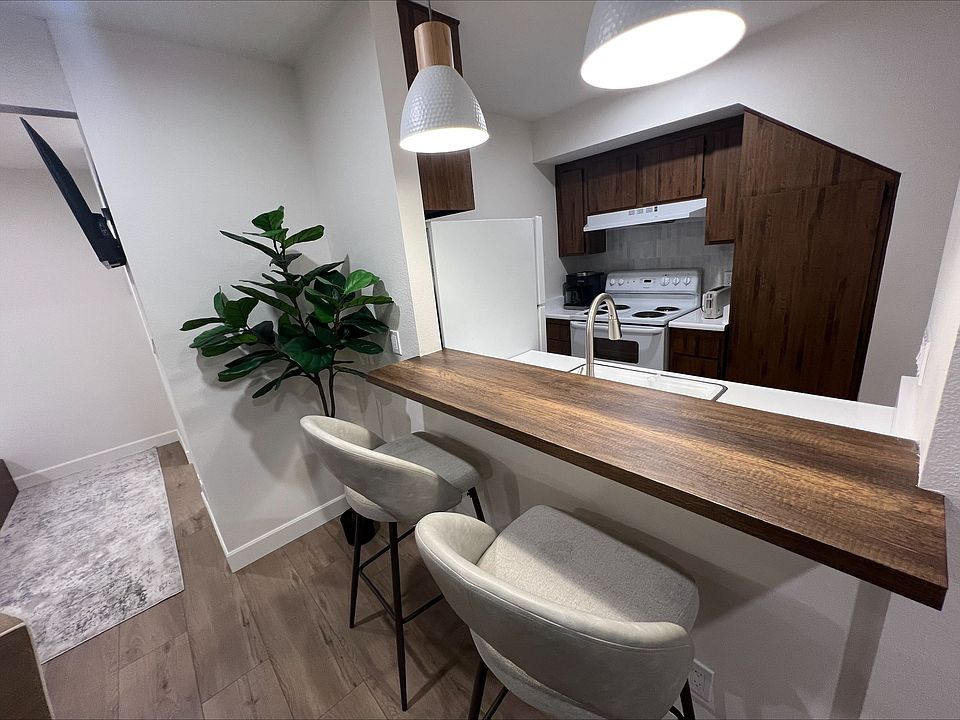 Large countertop space for meals, studying, and socializing, with beautiful bright dimmable pendent lights above.